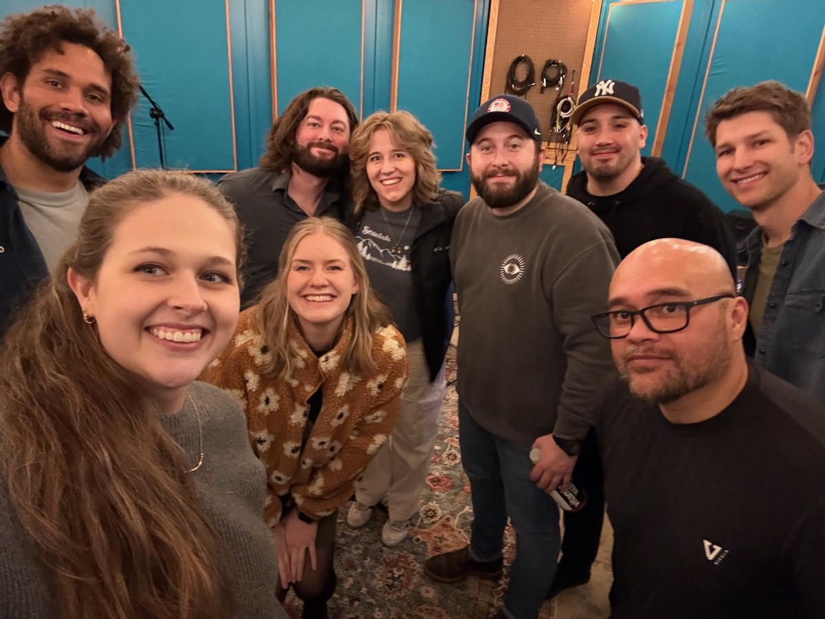 The band together at the studio